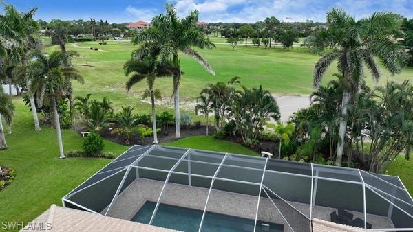 View of home's community with view of golf course, a yard, and a pool