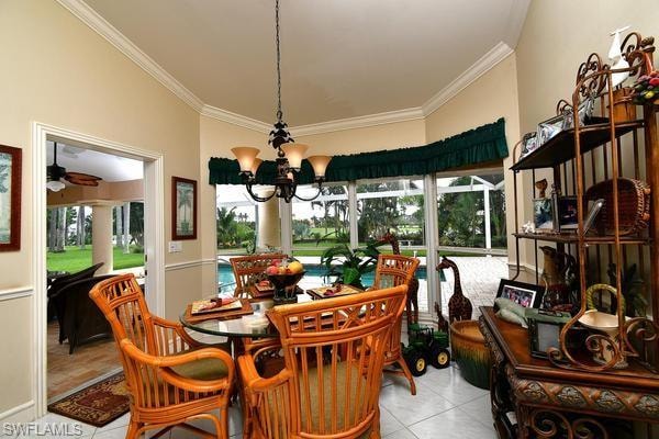 Dining space featuring a chandelier, plenty of natural light, light tile patterned floors, and crown molding