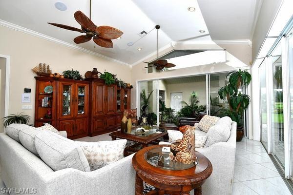 Living area with ornamental molding, lofted ceiling, ceiling fan, and light tile patterned floors