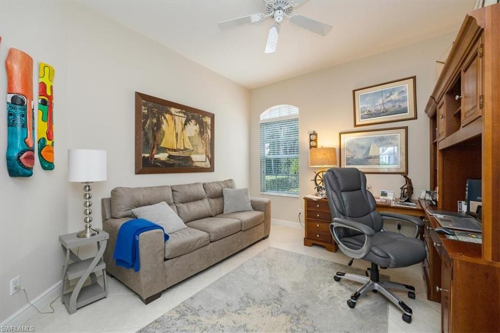 Tiled office with baseboards and ceiling fan