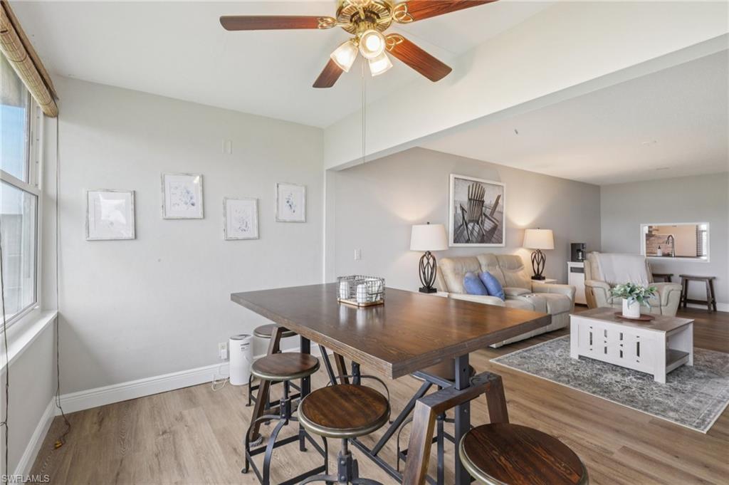 Dining room with ceiling fan and lots of natural light