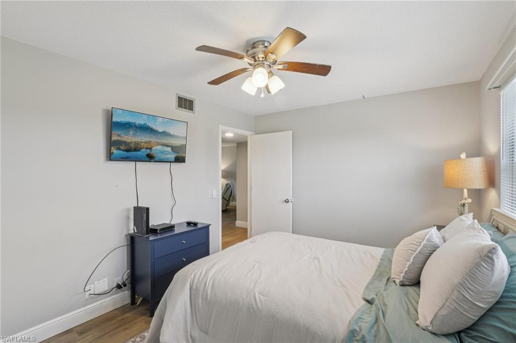 Bedroom featuring LVP floors and ceiling fan