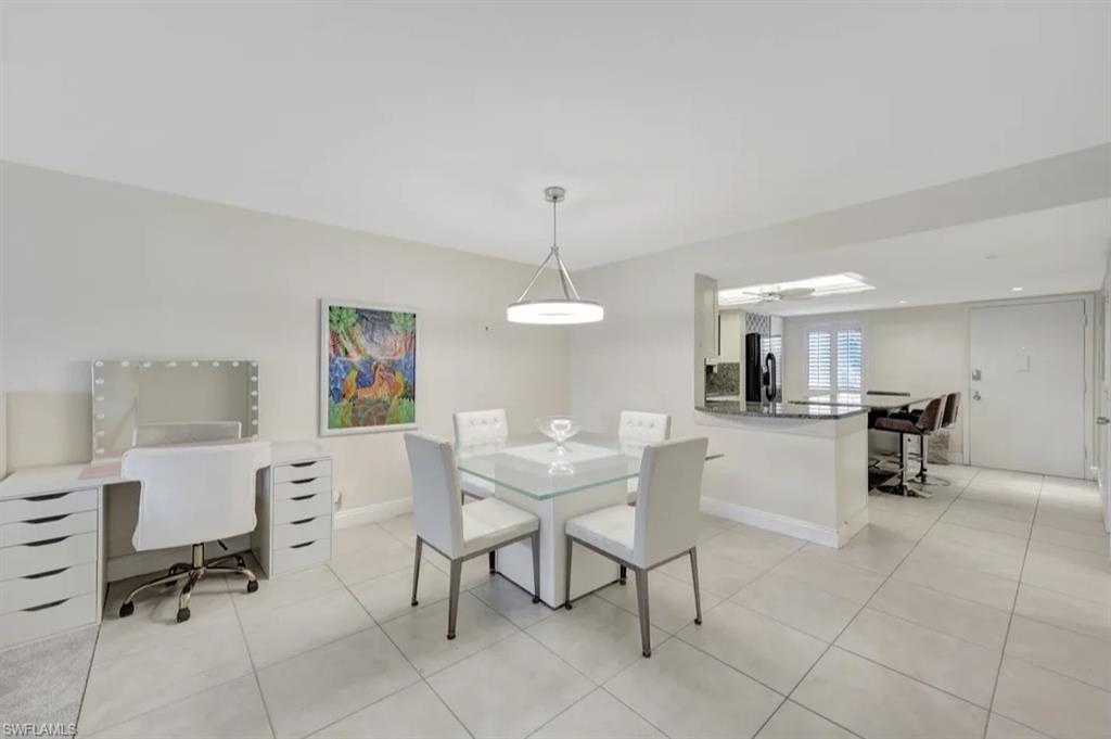 Dining room featuring light tile patterned floors