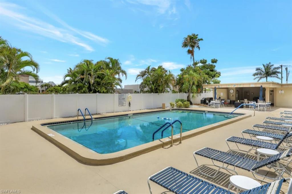 Community pool with a patio area