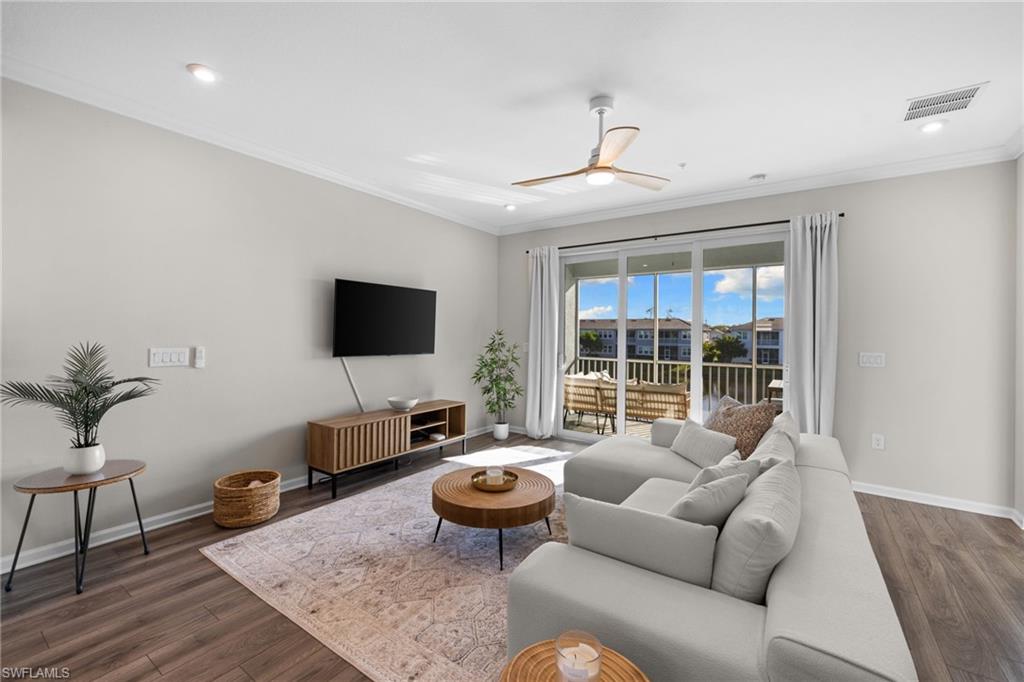 Living area with crown molding, wood finished floors, a ceiling fan, and recessed lighting