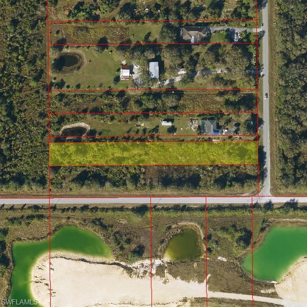 Aerial map of property and surrounding area featuring property parcel outlined