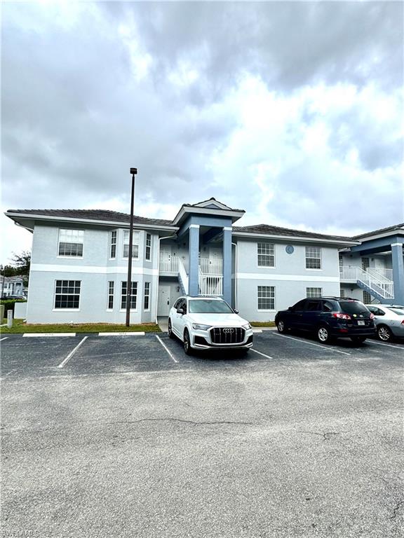 View of front of property featuring uncovered parking