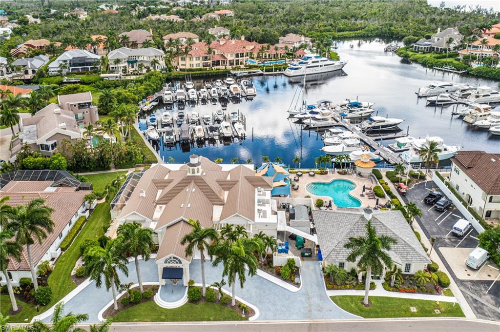 Bird's eye view of numerous boat docks and a large body of water
