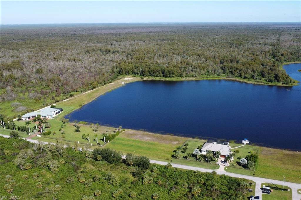 Aerial view of property's location featuring a nearby body of water