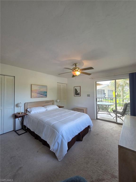 Bedroom with access to exterior, carpet, and ceiling fan