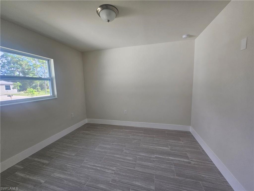 Empty room with baseboards