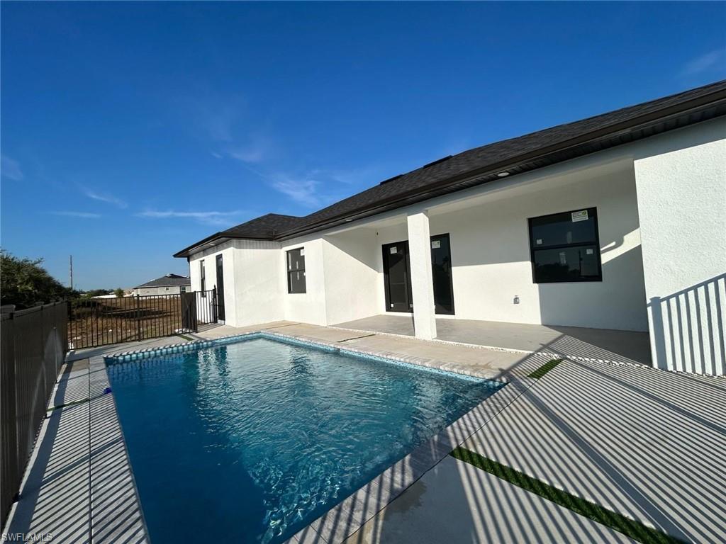 View of swimming pool with a patio
