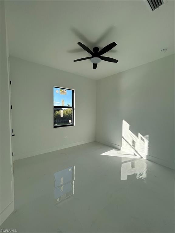 Unfurnished room featuring baseboards and a ceiling fan