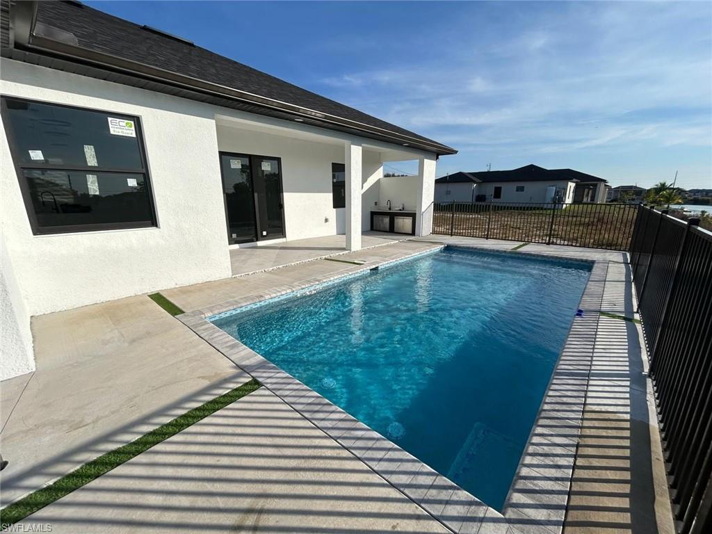 View of pool featuring a patio area