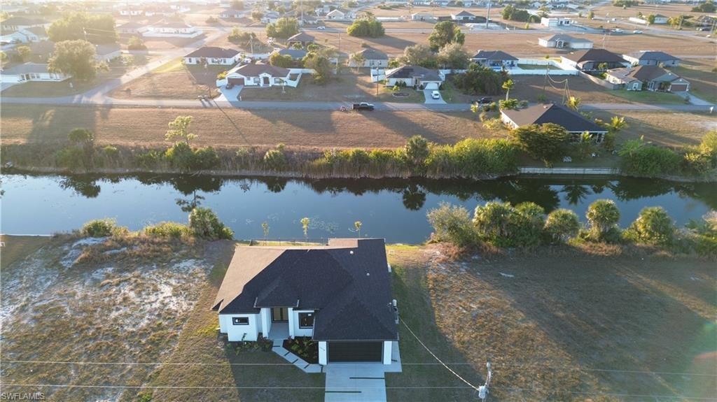 Aerial view of residential area with a large body of water