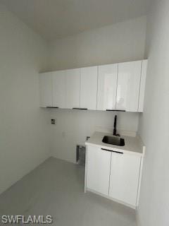 Washroom with cabinet space and hookup for a washing machine