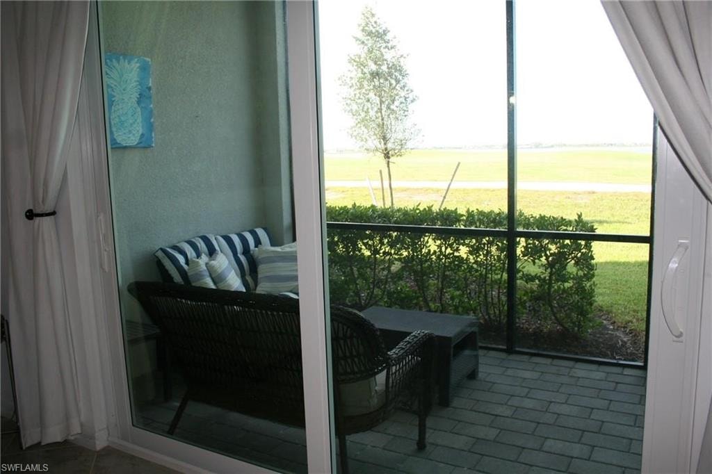 Balcony featuring a sunroom