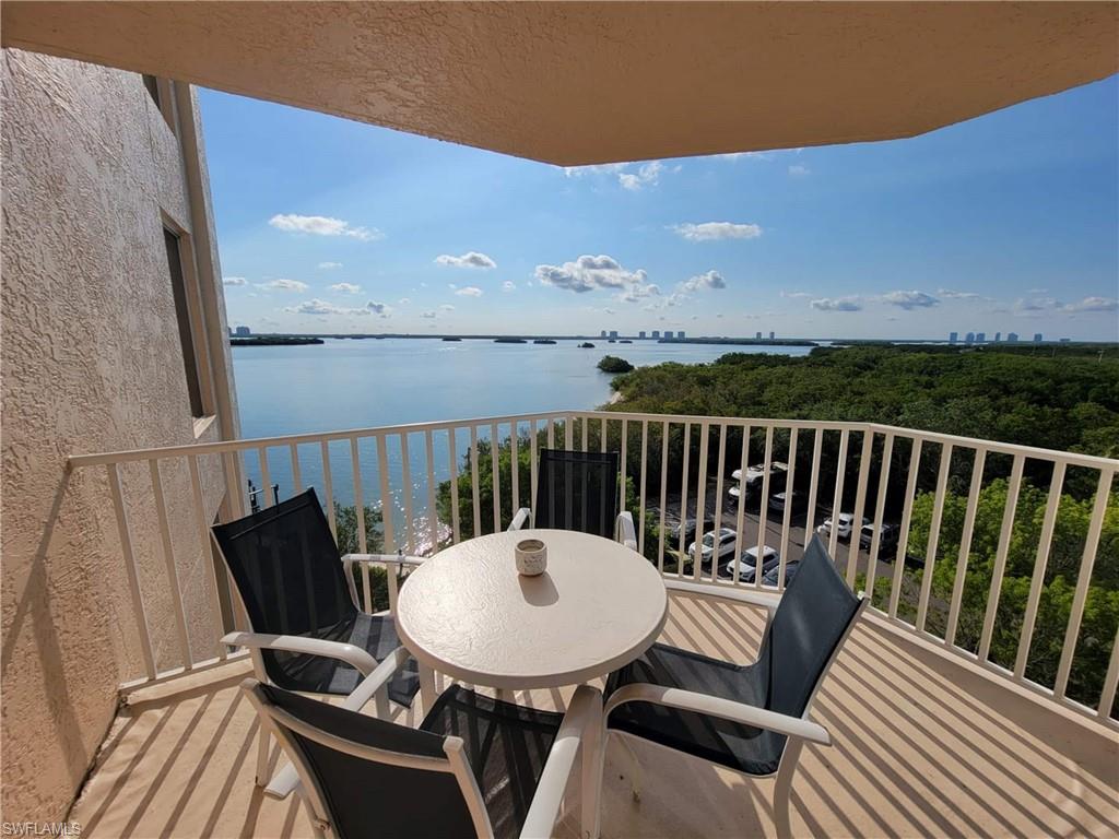 Private balcony with water scenery and distant city skyline