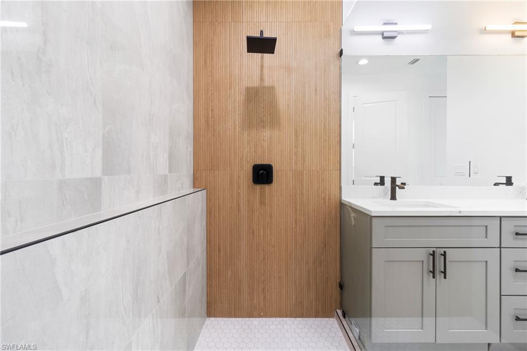 Bathroom with vanity and walk in shower