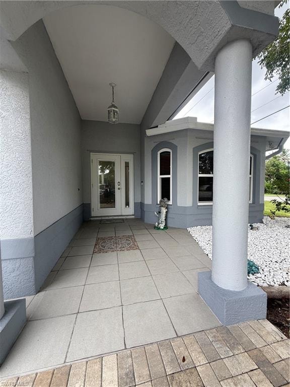 View of home's exterior with stucco siding, a yard, and a patio