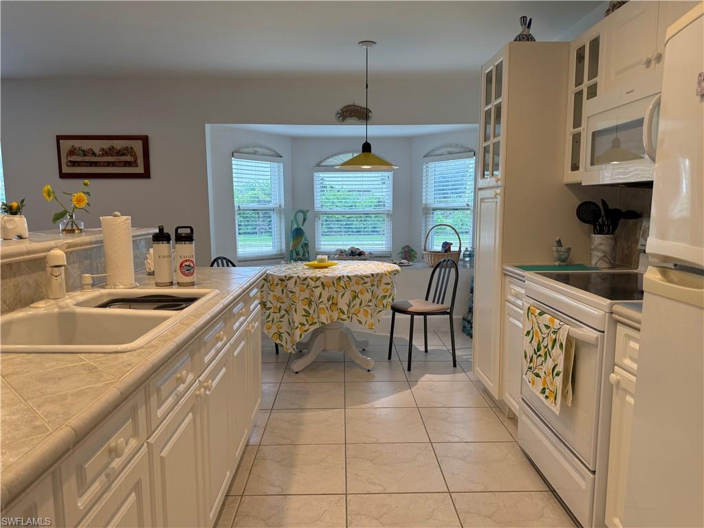 Dining area featuring light tile patterned flooring