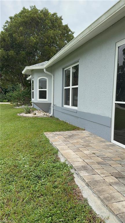 Sunroom with tile patterned flooring and french doors