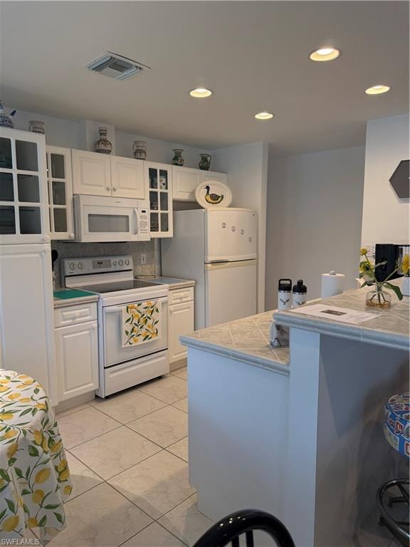 Bedroom with light tile patterned floors and baseboards