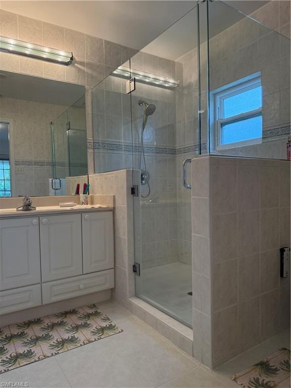 Bedroom with light tile patterned floors and access to exterior