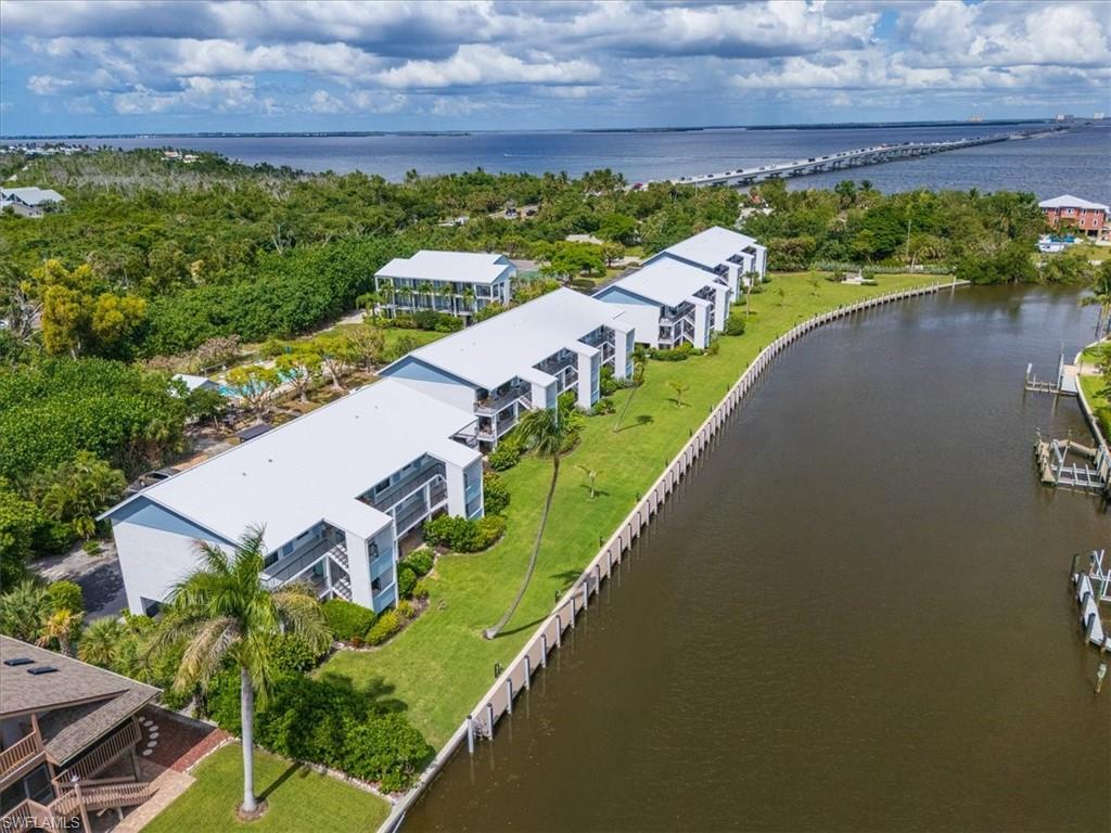 Drone / aerial view of a large body of water and a notable bridge