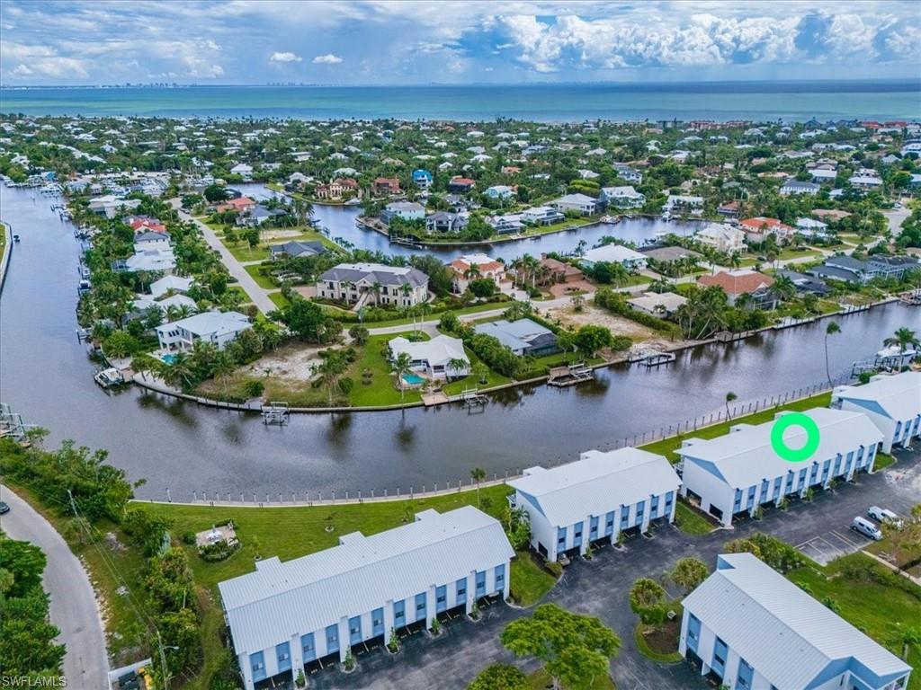 Aerial perspective of suburban area with a large body of water