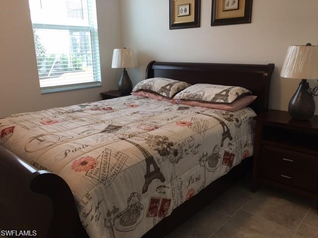 Bedroom featuring light tile patterned flooring