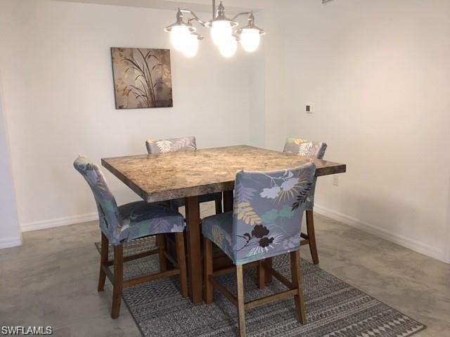 Dining space featuring a notable chandelier