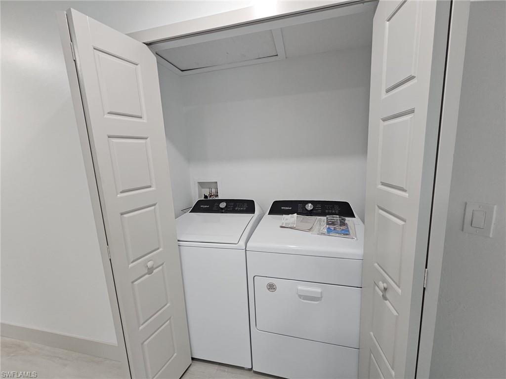 Laundry room with washing machine and dryer