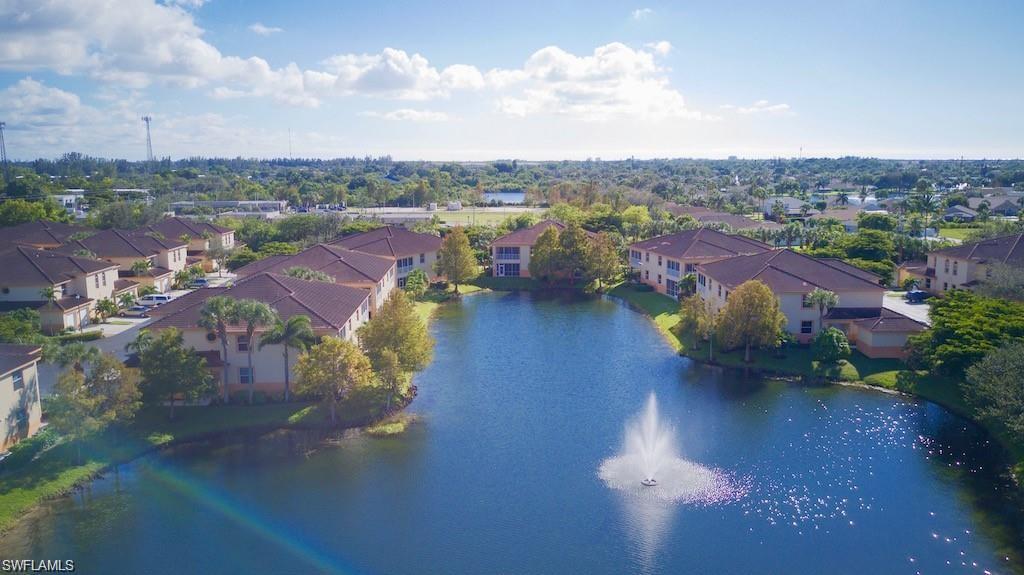 Aerial perspective of suburban area with a nearby body of water