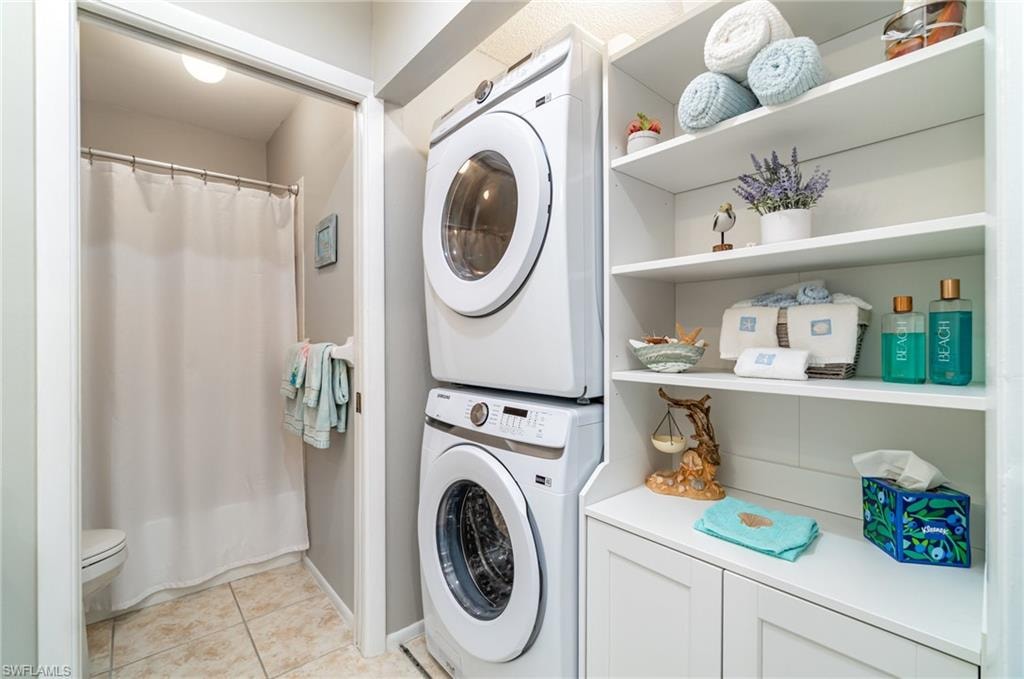 Samsung stackable full-size washer and dryer with cabinet for storage