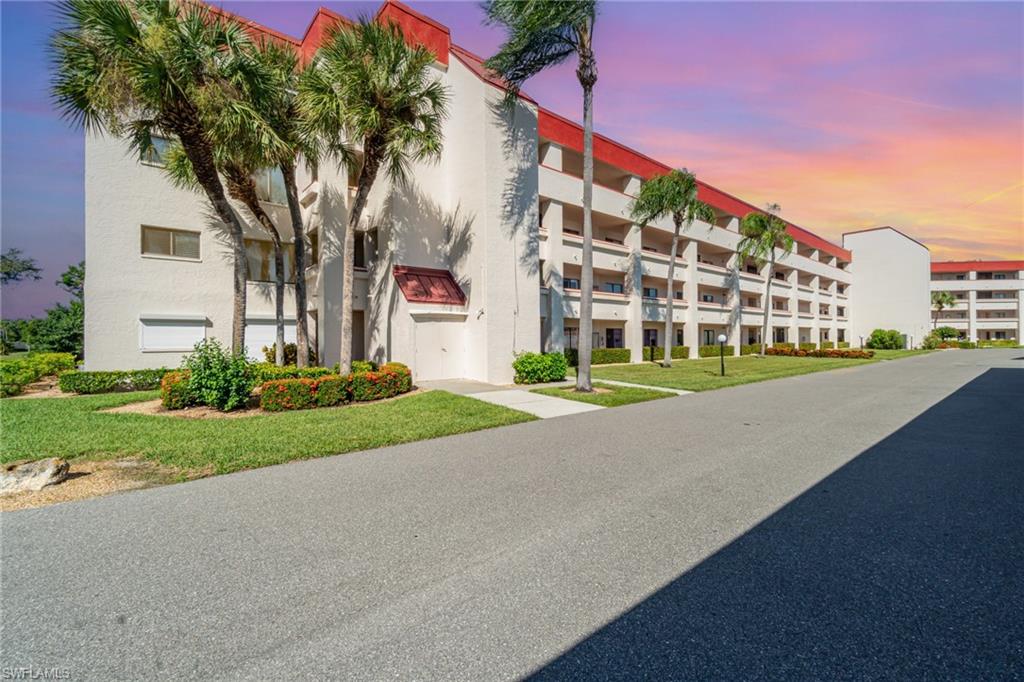 Front of building with stairs, which gives easy access to the condo, or use the common elevator