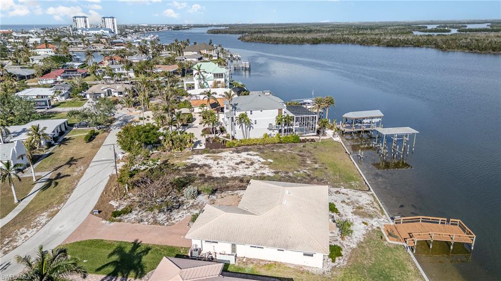 Aerial view of residential area with a large body of water