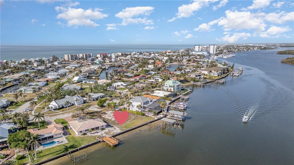 Spectacular oversized bayfront homesite—spanning over one-third of an acre—one of the highest elevations on the island and gracing the Estero Bay Estuary just moments from the sparkling Gulf waters and the sugar-white sands of Fort Myers Beach.