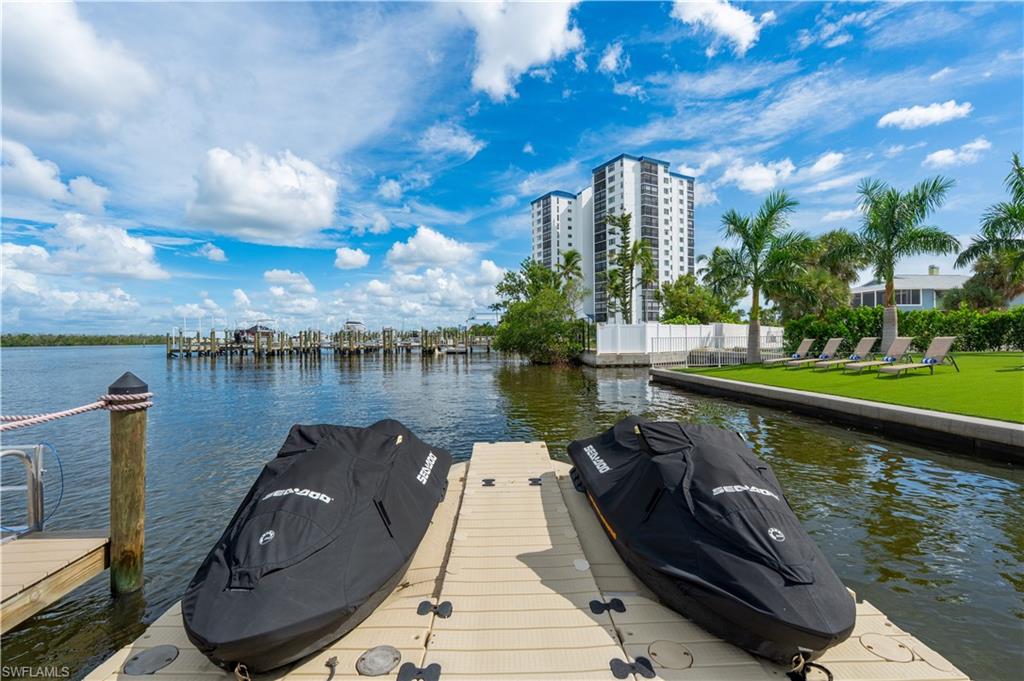 Dock area featuring a water view - Virtually Edited Image