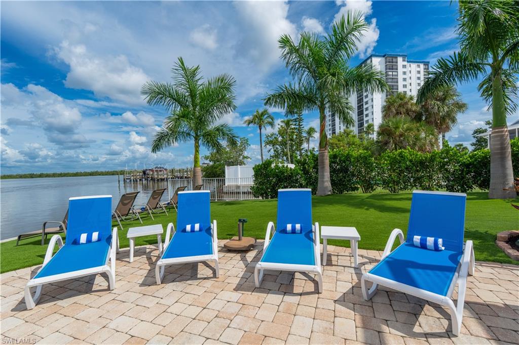 View of patio / terrace with a water view - Virtually Edited Image