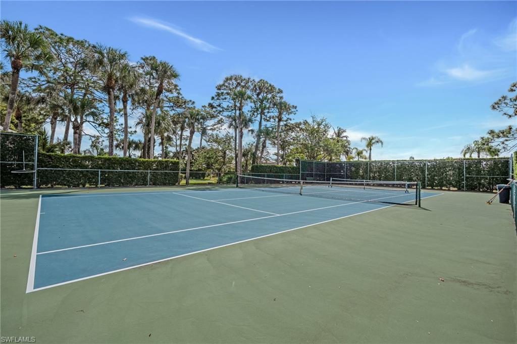 View of tennis court featuring community basketball court