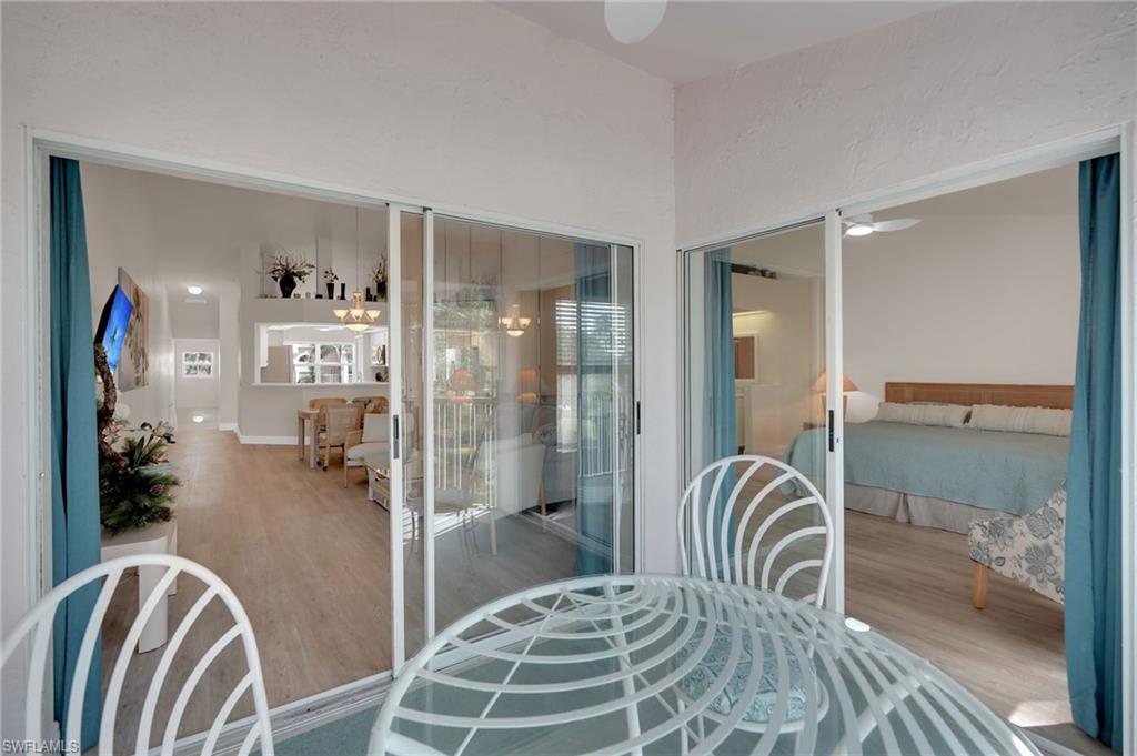 Screened balcony with double sliders allowing tons of natural light into the space