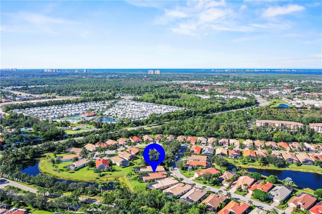 View of property location with nearby suburban area and a nearby body of water
