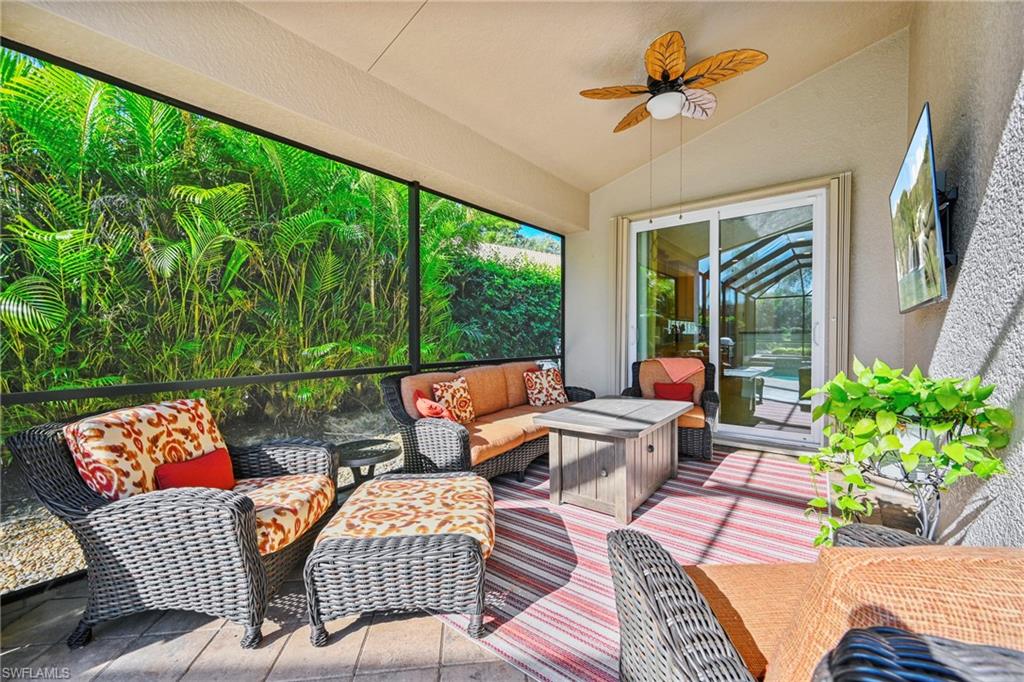 Sunroom with an outdoor living space, vaulted ceiling, and ceiling fan