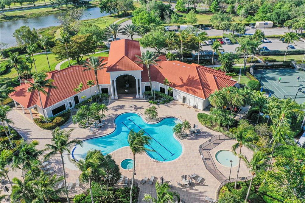 View from above of property with a pool and a nearby body of water