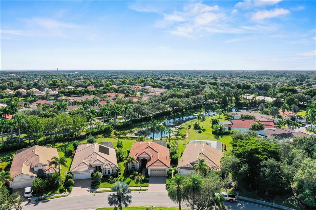 Aerial perspective of suburban area with a large body of water