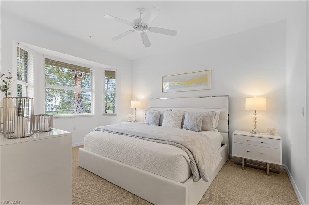 Primary bedroom faces South overlooking 4th fairway and pond with private bath and walk-in closets.