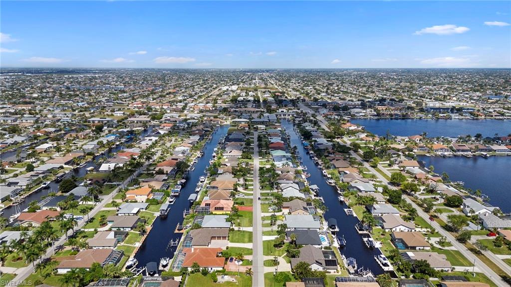 View of property location featuring nearby suburban area and a large body of water