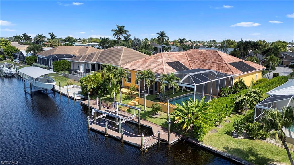 Aerial perspective of suburban area with a large body of water