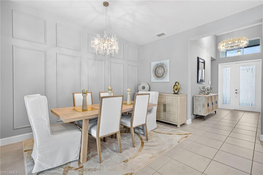 BEAUTIFUL decorative picture frame accent wall in dining area...